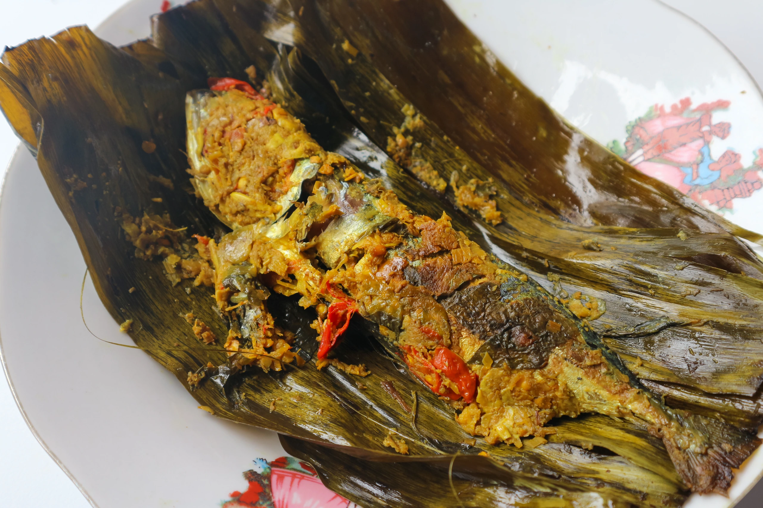 Pepes ikan kembung på tallrik, Östtimor